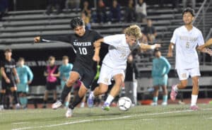 Xavier's Esteban Montoya and ND's Christian Habiniak battle for the ball. (Taylor Sobieski)